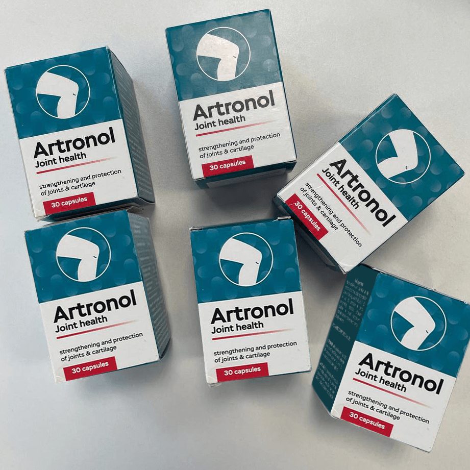Cajas y frascos de Artronol sobre un sofá gris